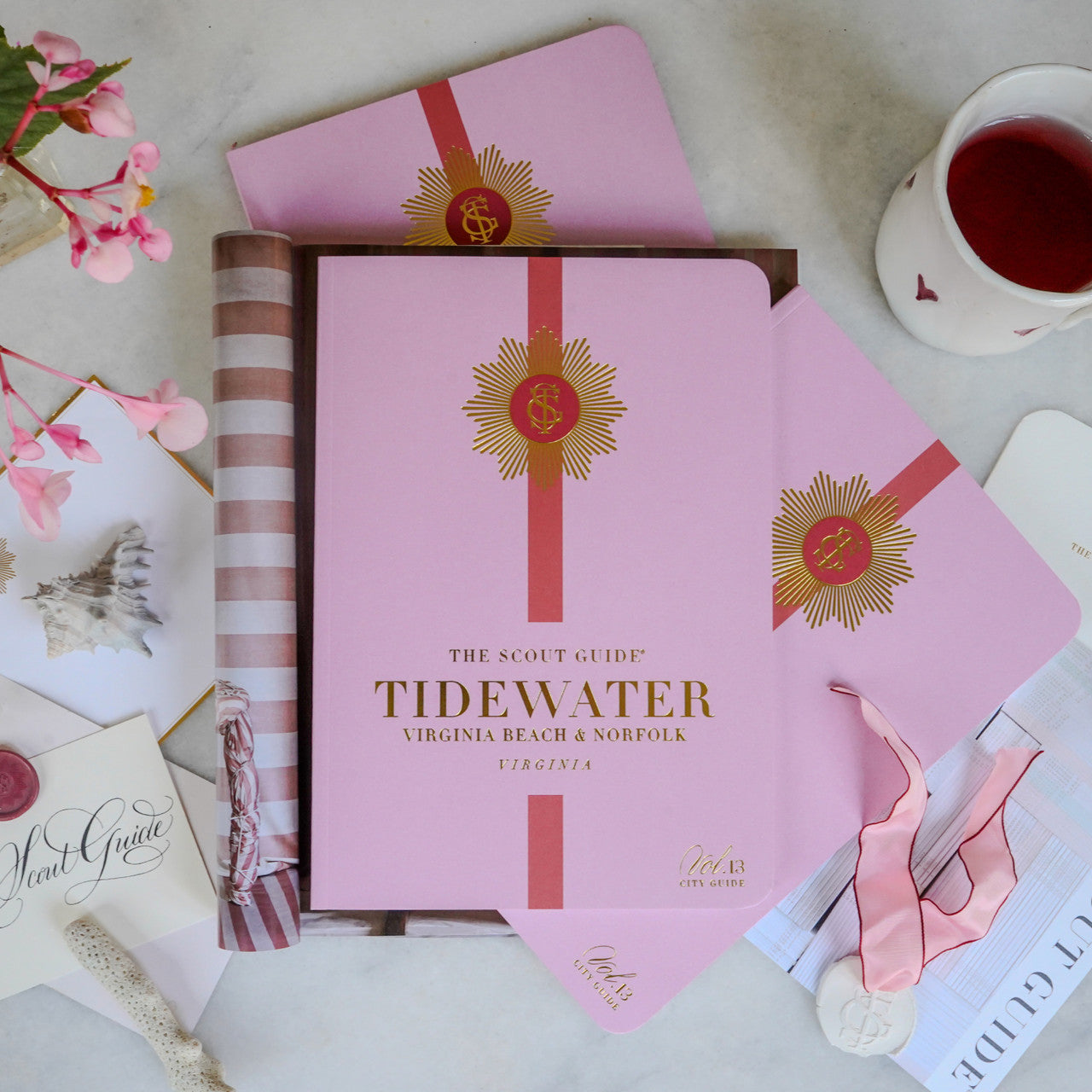 The Scout Guide Tidewater Volume 13, light pink cover with red stripe, gold foil title and TSG Medallion logo