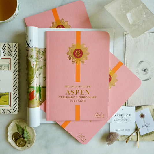 The Scout Guide Aspen Volume 12, light pink cover with orange stripe, gold foil title and TSG Medallion logo