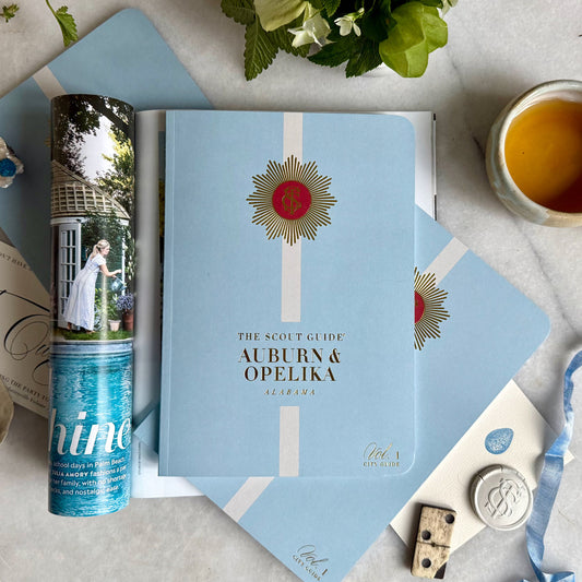 The Scout Guide Auburn & Opelika, Volume 1, light blue cover with cream stripe, gold foil title and TSG Medallion