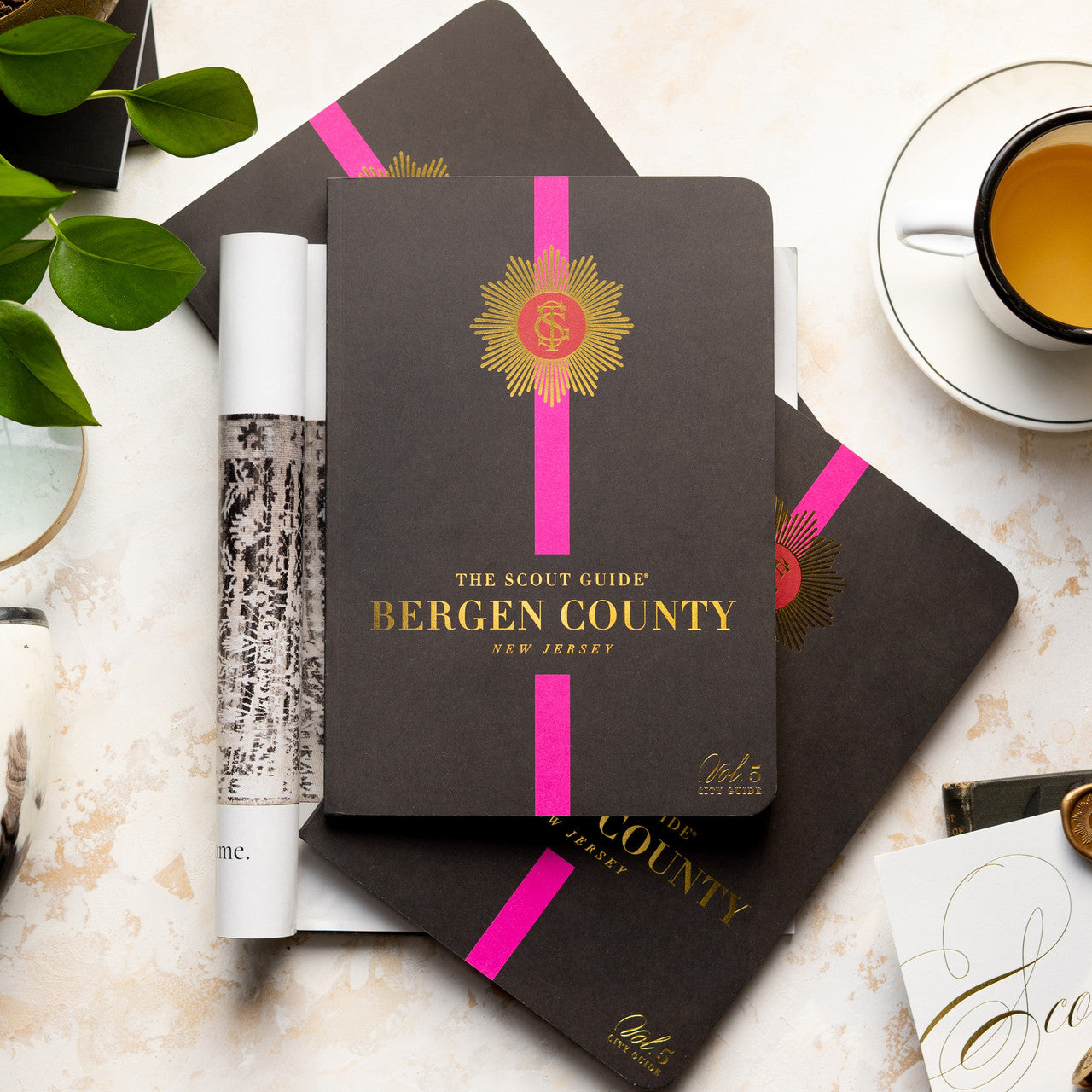 The Scout Guide Bergen County Volume 5, black cover with hot pink stripe, gold foil title and TSG Medallion logo