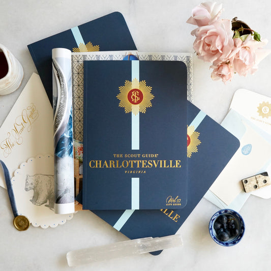 The Scout Guide Charlottesville, Volume 17, navy cover with light blue stripe, gold foil title and TSG Medallion