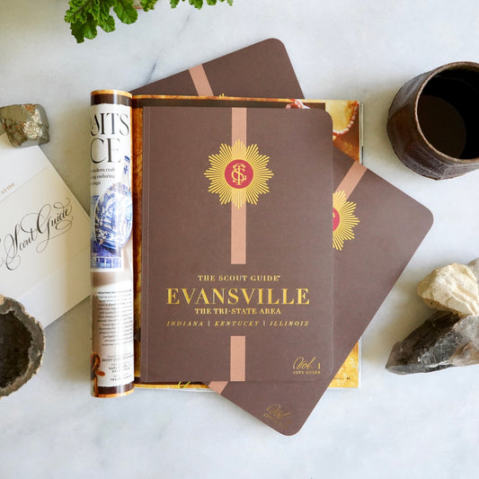 The Scout Guide Evansville & The Tri State Area Volume 1, brown cover with light brown stripe, gold foil title and TSG Medallion logo