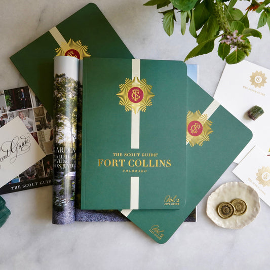 The Scout Guide Fort Collins Volume 2, dark green cover with cream  stripe, gold foil title and TSG Medallion logo