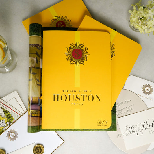 The Scout Guide Houston Volume 9, dark yellow cover with light yellow stripe, gold foil title and TSG Medallion logo