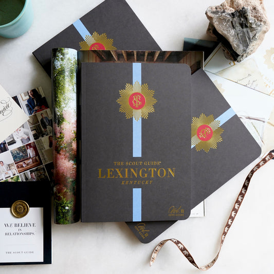 The Scout Guide Lexington Volume 11, black cover with blue stripe, gold foil title and TSG Medallion logo