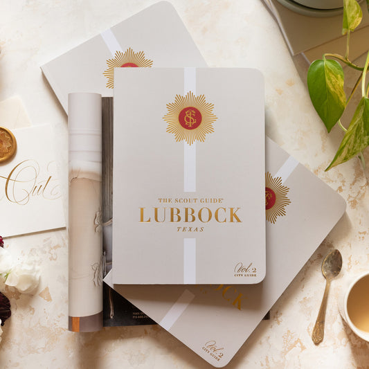 The Scout Guide Lubbock Volume 2, cream cover with white stripe, gold foil title and TSG Medallion logo