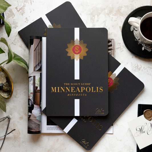 The Scout Guide Minneapolis Volume 7, black cover with white stripe, gold foil title and TSG Medallion logo