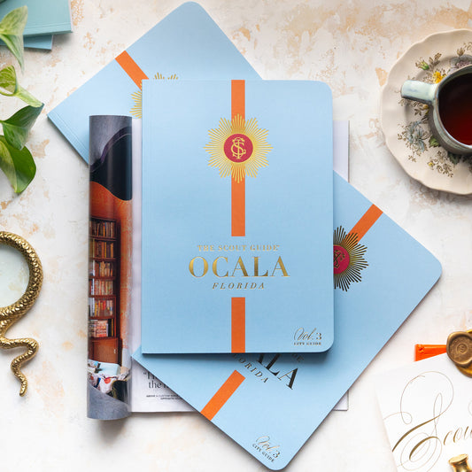 The Scout Guide Ocala Volume 3, light blue cover with burnt orange stripe, gold foil title and TSG Medallion logo