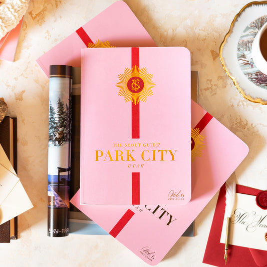 The Scout Guide Park City Volume 6, light pink cover with red stripe, gold foil title and TSG Medallion logo