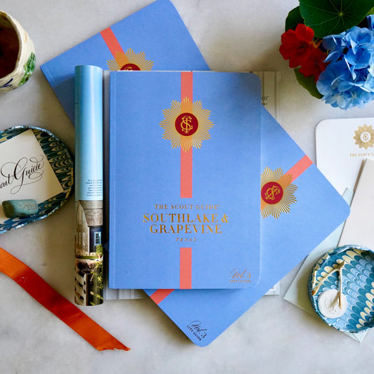 The Scout Guide Southlake & Grapevine Volume 3, bluecover cover with peach stripe, gold foil title and TSG Medallion logo