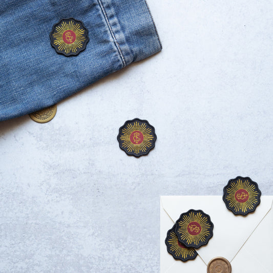 Medallion Logo Patch. Gold metallic thread, black background.