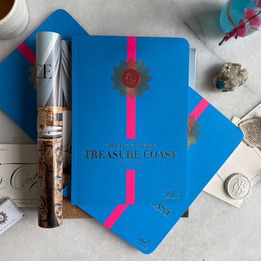 The Scout Guide Treasure Coast Volume 1, dark blue cover with hot pink stripe, gold foil title and TSG Medallion logo