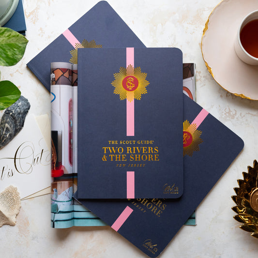 The Scout Guide Two Rivers & The Shore Volume 13, navy blue cover with light pink stripe, gold foil title and TSG Medallion logo