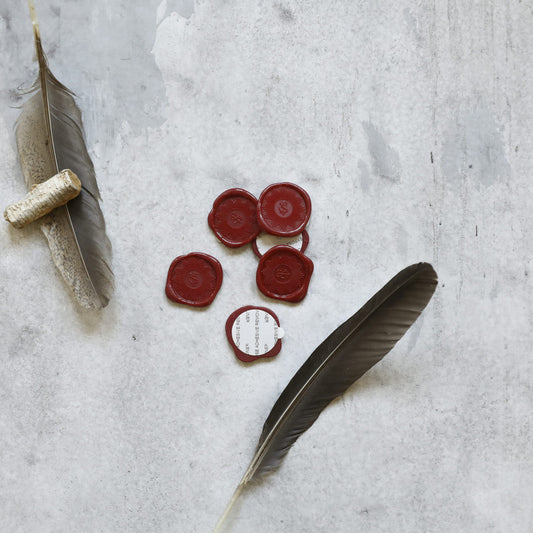 Adhesive Wax Seals - red, styled with feather